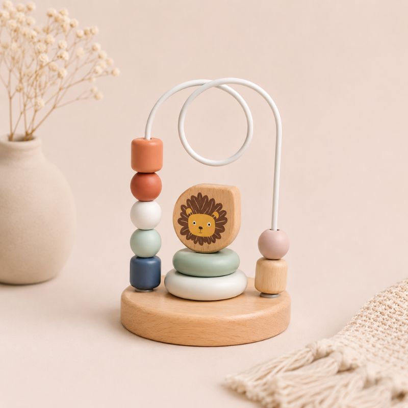 Bead maze Wooden baby toy with colorful beads and a lion figure on a beige background