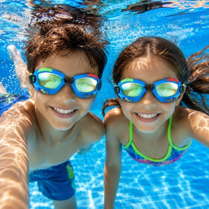 Boy and girl swimming underwater wearing Bling2o Gamer Console Cobalt swim goggles in a swimming pool