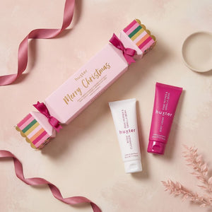 Huxter Pink Pepper & Vanilla Bean body care gift set in overhead blush flat lay