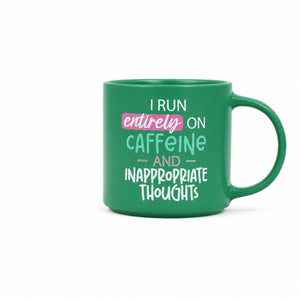 A Cheeky Caffeine Mug with a humorous quote printed on the side: 'I RUN entirely ON CAFFEINE AND INAPPROPRIATE THOUGHTS' in white and light blue lettering with a pink highlight, set against a plain white background.