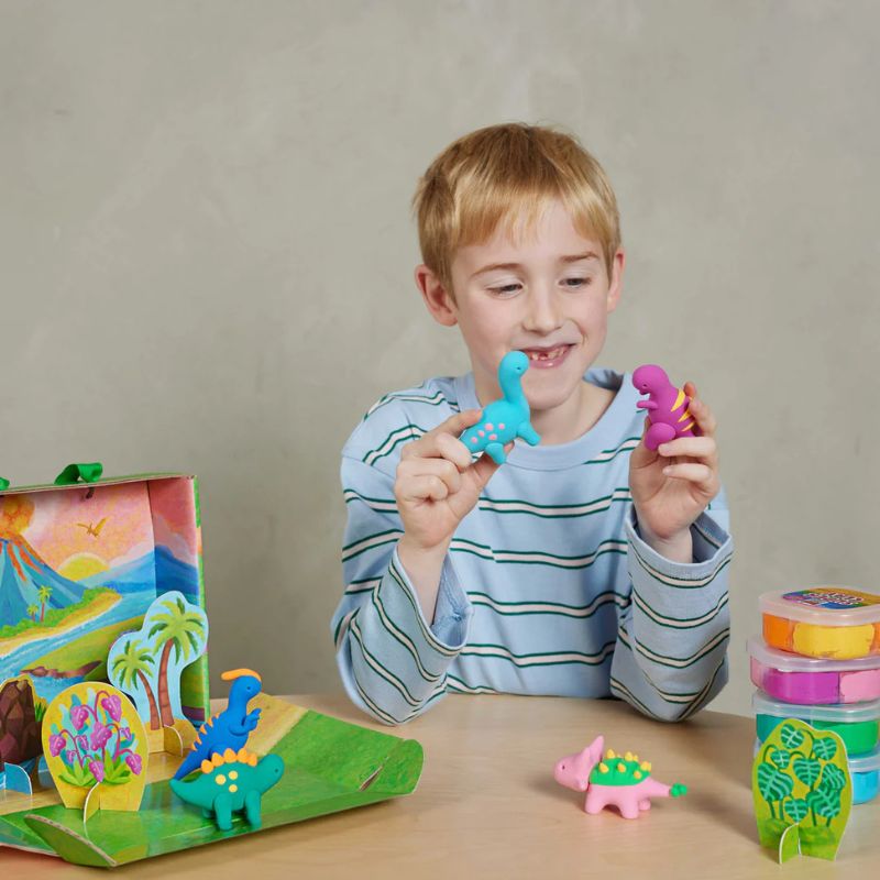 Child playing with Claytopia dinosaur clay set creative kids activity