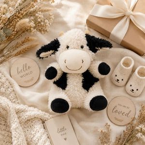 Curly Cow Soft Toy White & Black 18cm styled with baby gifts and nursery accessories by Love Shack Giftware