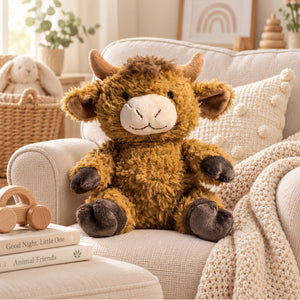 Brown Highland Cow soft toy styled in a neutral nursery