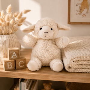 White curly sheep plush toy displayed on nursery shelf with wooden blocks and neutral décor by Love Shack Giftware