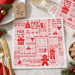F#ck Christmas paper napkins styled with Christmas decorations and gold cutlery