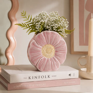 Pink flower-shaped vase with greenery on top of books in a home - decor setting—Loveshack Giftware
