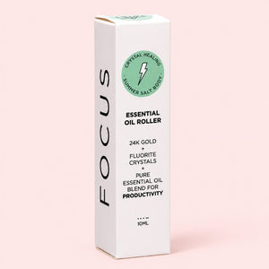 Focus Essential oil roller packaging with branding on a pink background