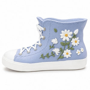 Gym Boot Resin Vessel Blue 11cm Light blue high-top sneaker with floral embroidery on a white background