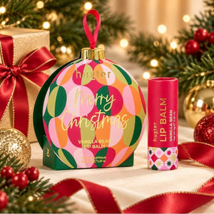 Huxter Vanilla Bean lip balm bauble styled as a Christmas gift