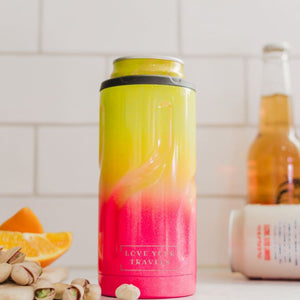 Gradient pink to yellow thermos with 'Love Your Travels' text on a kitchen counter.