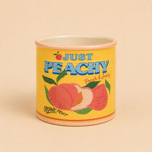 Ceramic jar with 'Just Peachy' label on a beige background