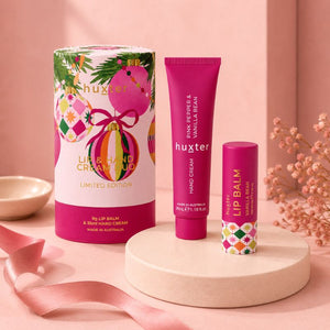 Huxter Limited Edition gift set with Pink Pepper and Vanilla Bean hand cream and Vanilla Bean lip balm in blush studio setting