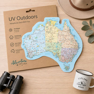 Map of Australia on a cardboard backing with 'UV Outdoors' branding, surrounded by binoculars and a mug. - Loveshack Giftware
