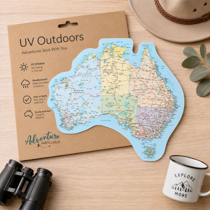 Map of Australia on a cardboard backing with 'UV Outdoors' branding, surrounded by binoculars and a mug. - Loveshack Giftware