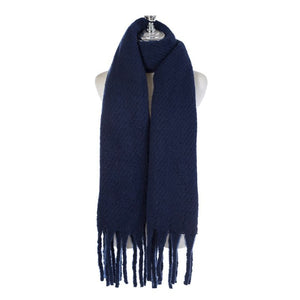 A Navy Blue Chunky Knit Winter Scarf with Fringe, displayed on a white mannequin torso against a plain white background.