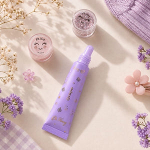 Oh Flossy Grape Natural Lip Gloss tube in aesthetic pastel flat lay