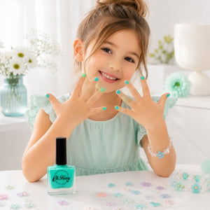 Young girl showing aqua painted nails with Oh Flossy Kids Nail Polish