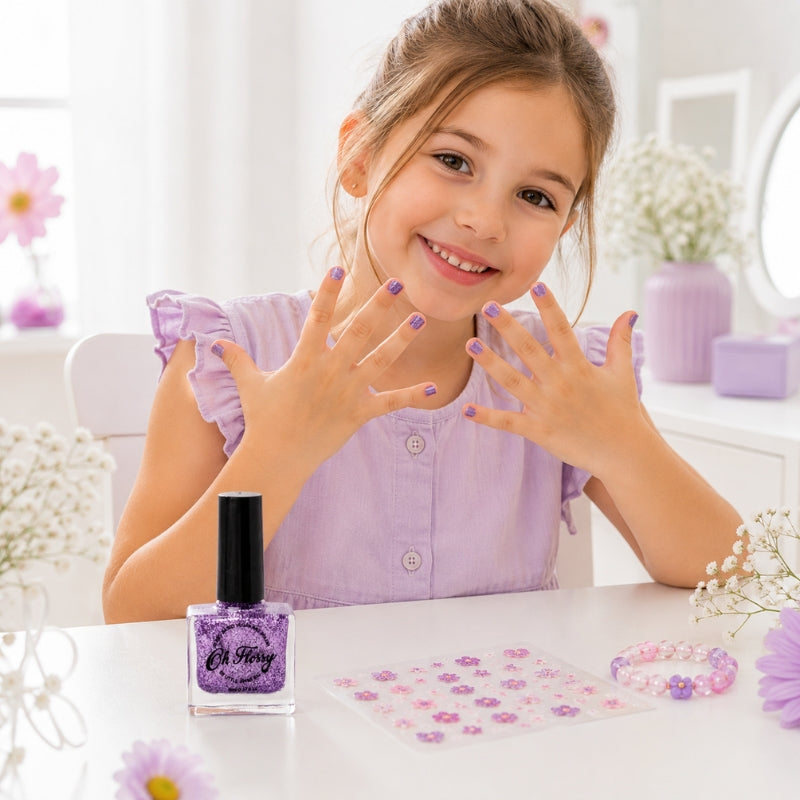 Young girl showing her purple glitter painted nails with Oh Flossy Kids Nail Polish