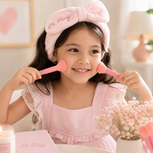 Young girl using Oh Flossy Sprinkle Makeup Brushes for playful kids makeup