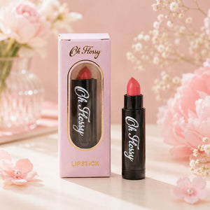 Oh Flossy Natural Lipstick for Kids in pink packaging and black tube styled with pink flowers