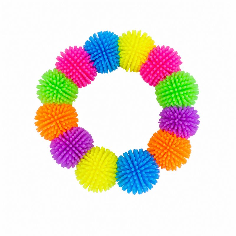 A pom-pom squishy bracelet with 12 brightly colored, textured nubs arranged in a ring on a plain white background.