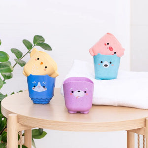 Tiger Tribe animal cups arranged on table aesthetic kids toy display