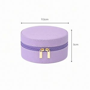 A Small Travel Jewellery Case_Violet with gold-tone zipper pulls, shown with dimension lines indicating a width of 11.5cm and a height of 5cm on a white background.