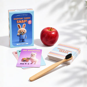 Everyday Things Snap game box with cards, apple and toothbrush on a bright white background
