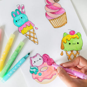 A hand drawing with markers at desk