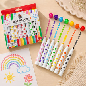 Set of colorful Tiger Tribe dot paint markers with packaging on a beige surface - Loveshack Giftware