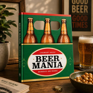 Beer Mania packaging with bottles and a glass of beer on a wooden table.