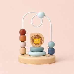 Bead Maze Wooden toy with colorful beads and a lion face on a pink background