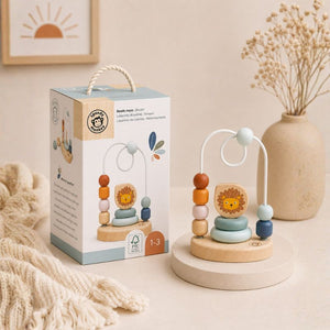 Bead Maze Wooden toy with colorful beads and a lion figure next to its packaging on a neutral background.