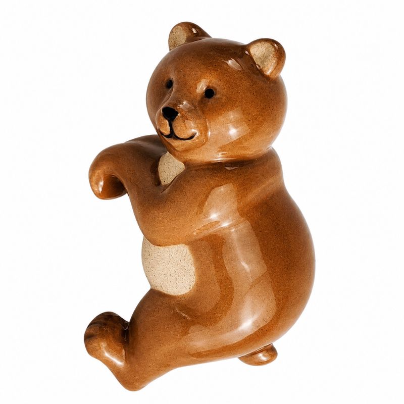 A glossy ceramic figurine of a sitting bear in shades of brown with a cream-colored chest patch, isolated on a white background.-Bear Pot Hanger