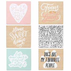 Collection of six decorative wooden blockword plaques featuring inspirational, home-themed, and pet-themed quote designs in soft pastel and natural wood finishes.