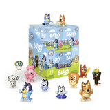 Collection of Bluey toy figures with their packaging on a white background