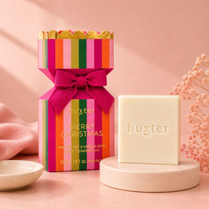 Huxter Merry Christmas Body Cleansing Bar gift box with ivory cleansing bar on blush background