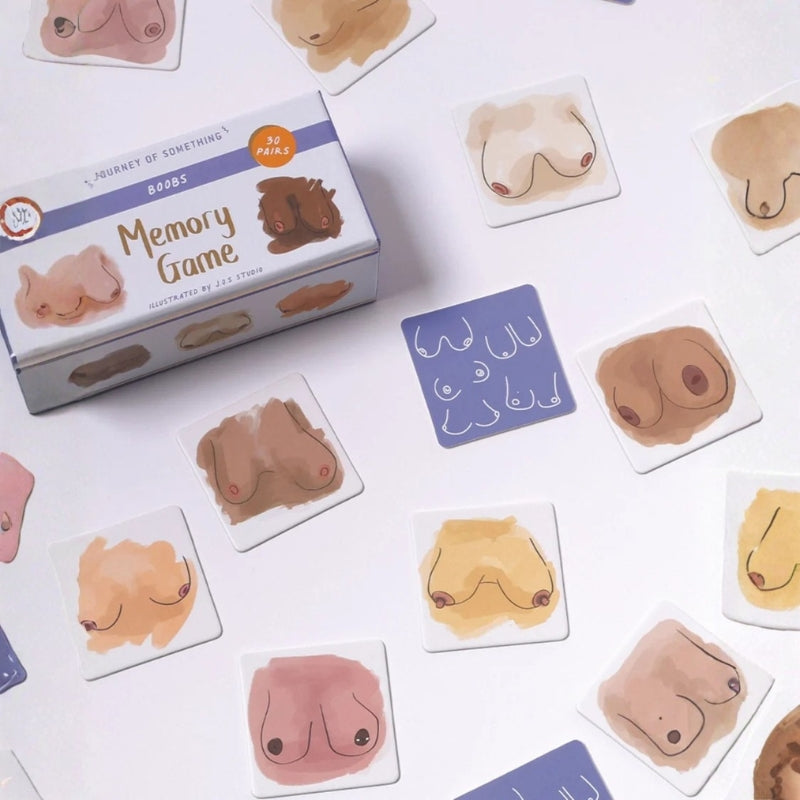 Boobs Memory game box surrounded by illustrated matching cards on a light background