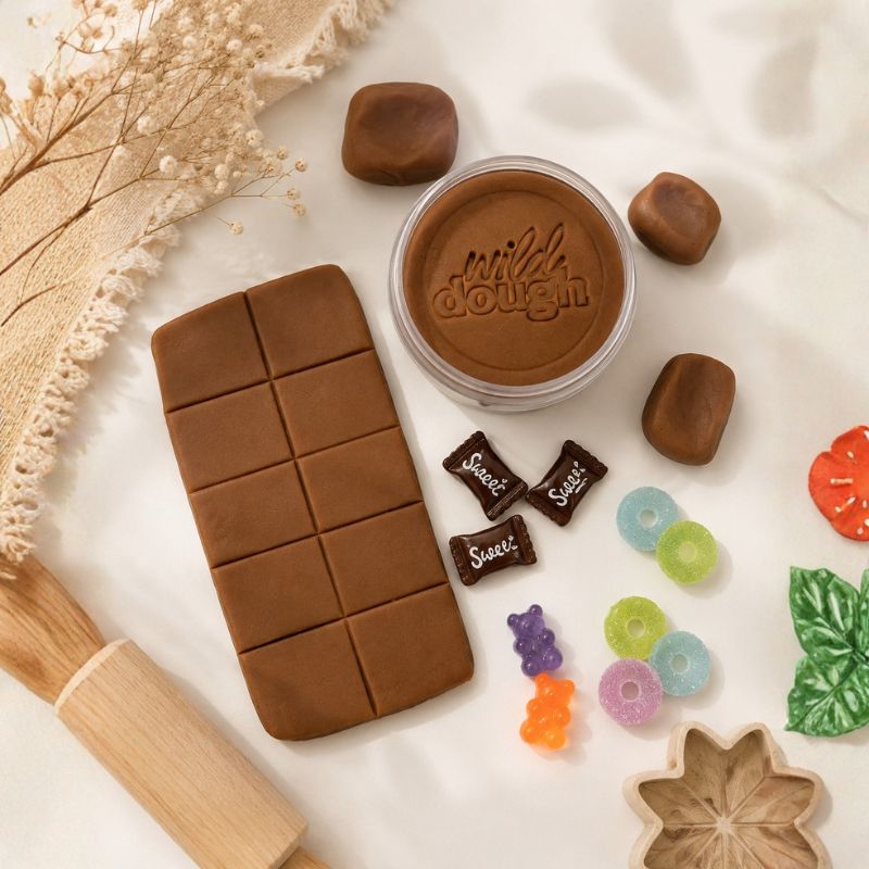 Chocolate Brown Playdough styled with chocolate shapes, rolling pin, wooden cutter, and sensory play accessories