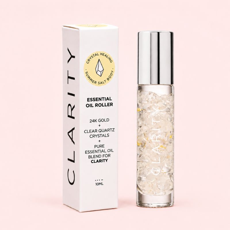 Clarity Essential oil roller with packaging on a pink background