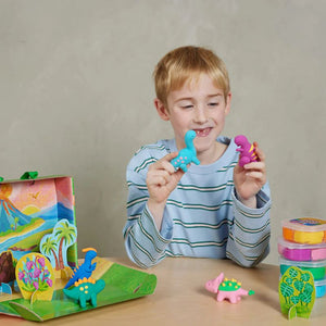 Child playing with Claytopia dinosaur clay set creative kids activity