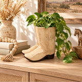 Tan cowboy boot planter styled in a Western inspired home
