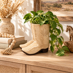 Tan cowboy boot planter styled in a Western inspired home