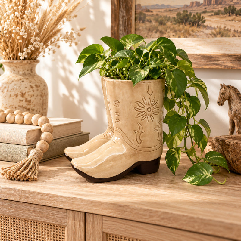 Tan cowboy boot planter styled in a Western inspired home
