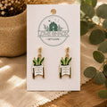 Crazy Plant Lady dangle earrings on a card with 'Love Shack Giftware' branding, surrounded by greenery.