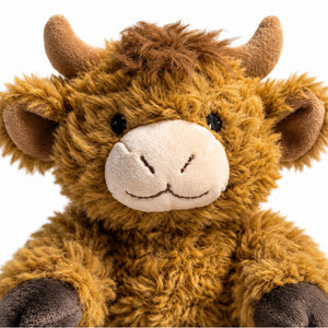 Close-up of Curly Highland Cow plush showing soft brown fur and horns