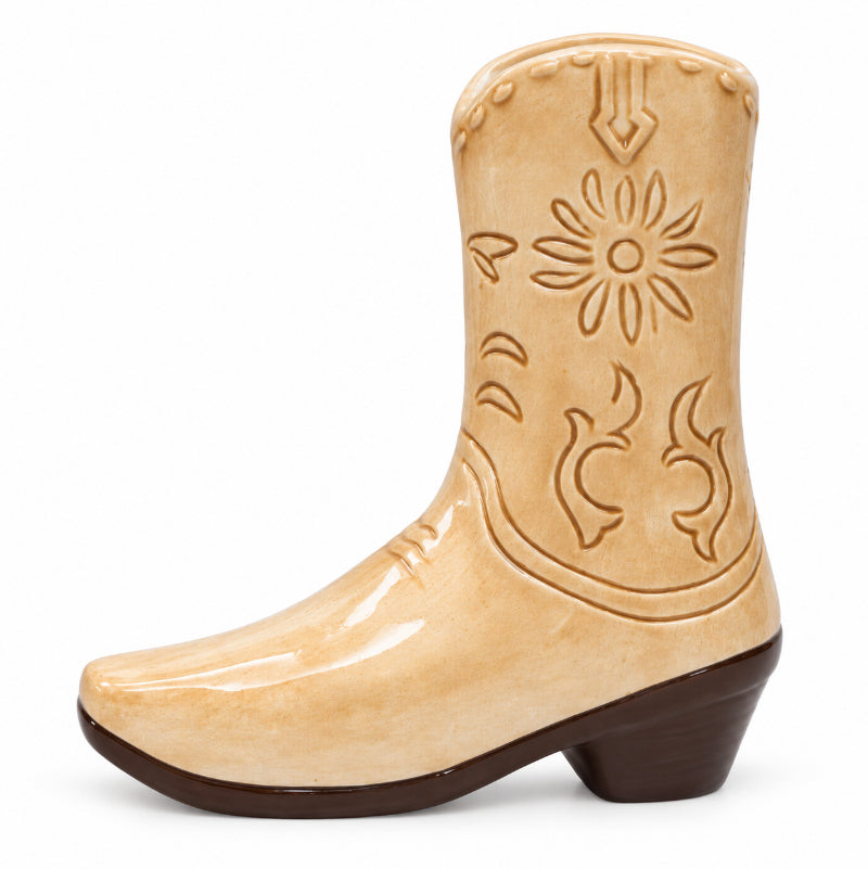 Tan ceramic cowboy boot vase with embossed Western design