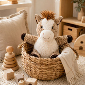 Curly Horse Soft Toy Brown 18cm sitting in woven basket in farmhouse playroom, cuddly plush horse toy by Love Shack Giftware