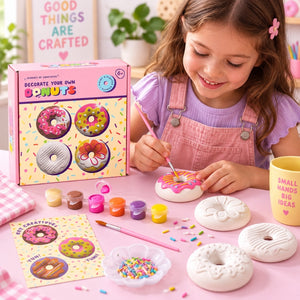 Girl painting a plaster donut with the Decorate Your Own Donuts craft kit