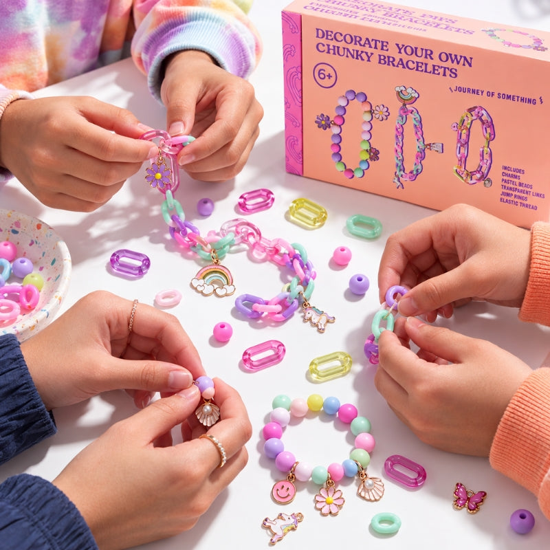 Kids creating colourful chunky bracelets together using pastel links and charms